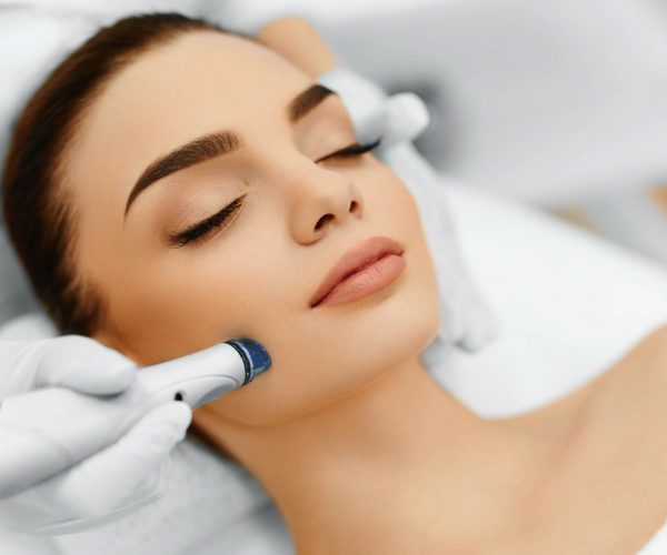 Close-up Of Woman Getting Facial Hydro Microdermabrasion